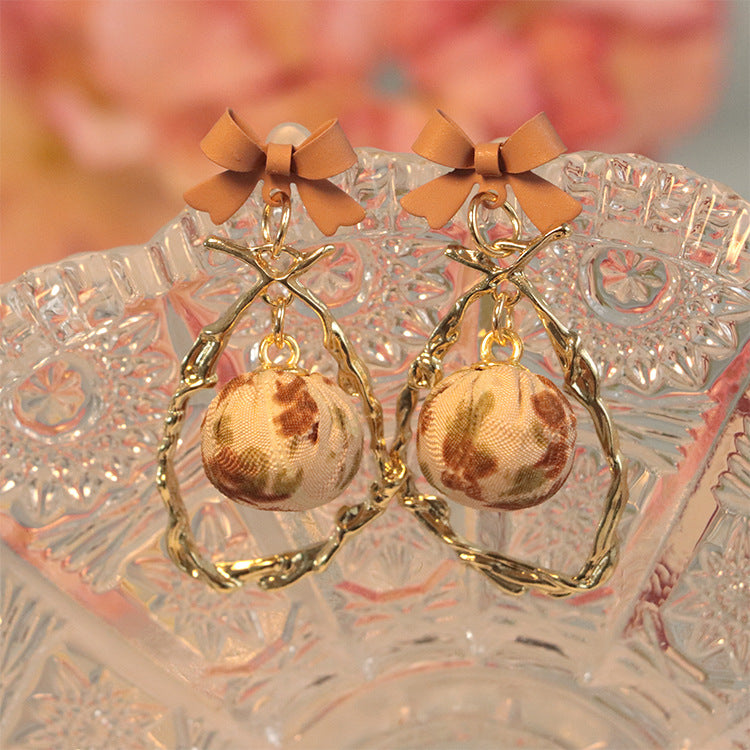 Wholesale Bow Hollow Alloy Earrings